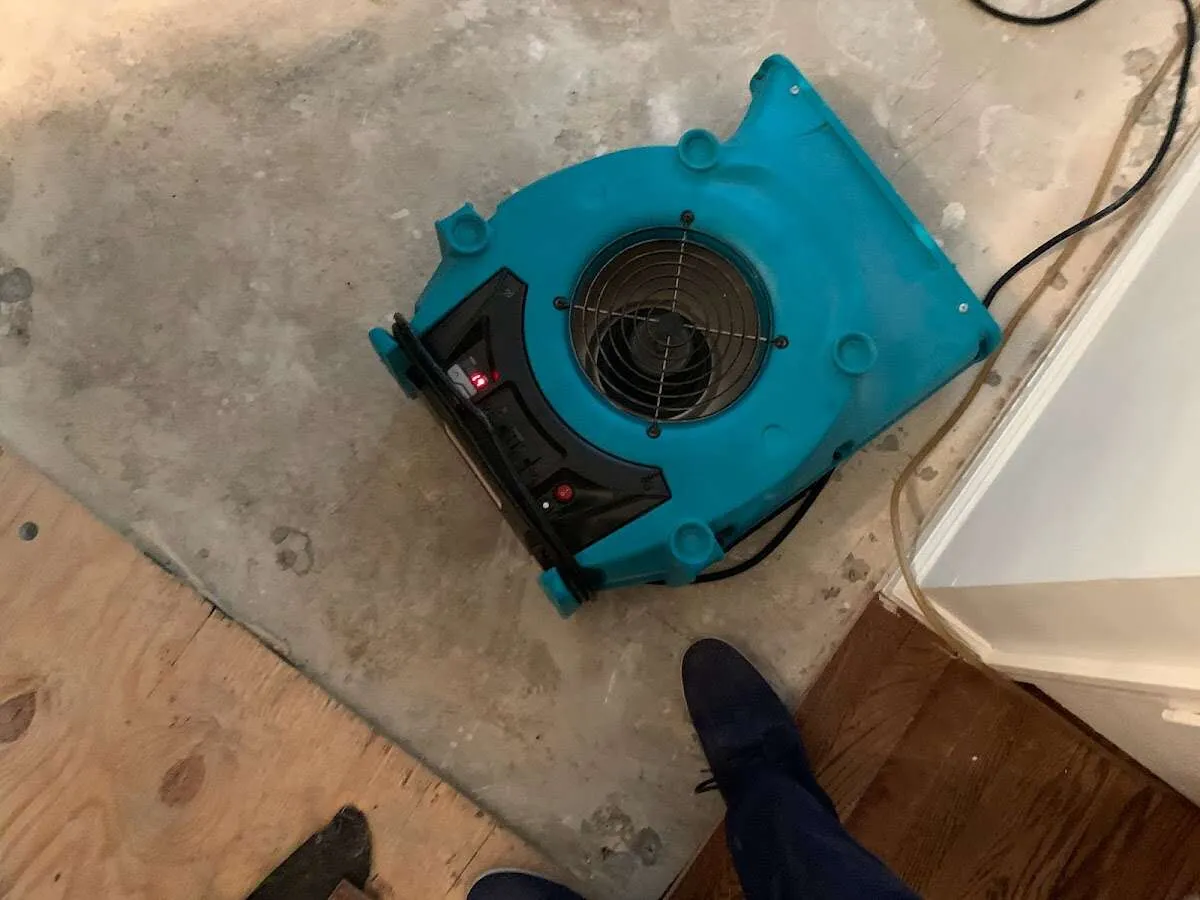 Air mover drying subfloor during Leak Detection & Repair in Maumelle